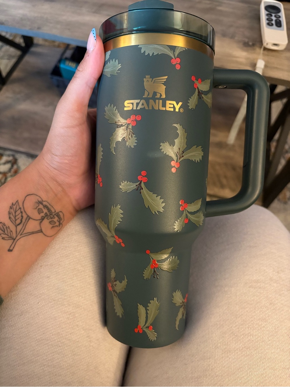 Stanley Green Travel Mug with Gold Logo and Red Berry Accents